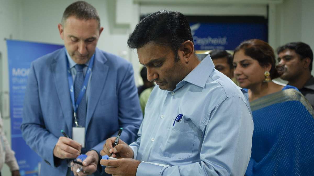 Laurant Bellon Cepheid Global (L) and Dr K Sudhakar (R) signing the TB cartridges